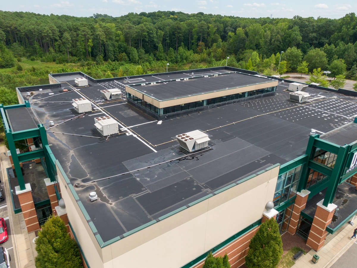 A rubberized roof coating shown on a commercial roof